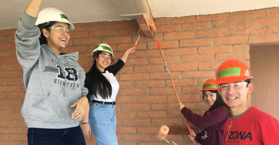 Young Lasallian Youth Club volunteers Berenice Ramos, Isabella Sesteaga, Stephanie Jimenez, and Phillip Gil, from San Miguel High School (class of 2020) in Tucson, AZ, participate in Habitat for Humanity Tucson. (Photo courtesy Rachel Bowers, Lasallian Youth Director, San Miguel High School)