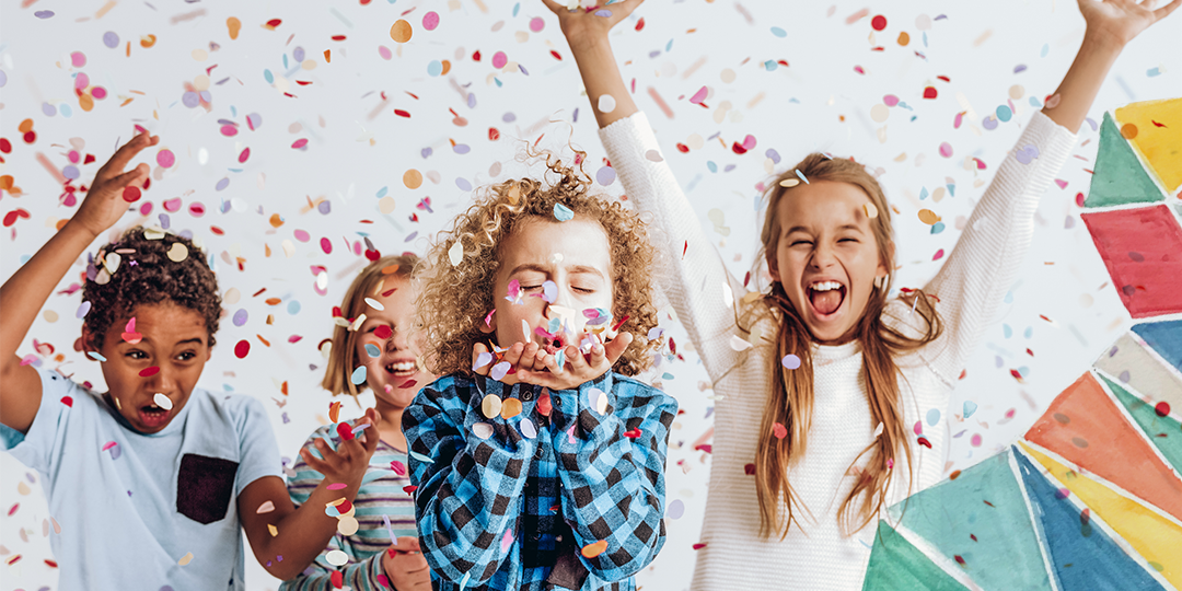 Kids throwing confetti excitedly