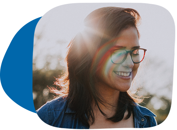 Teen smiling with sun shining behind